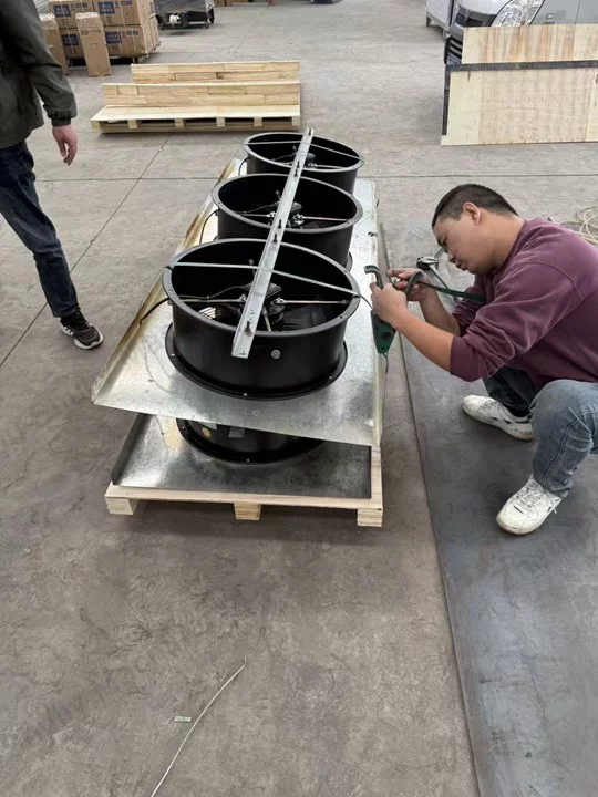Workers manufacturing fans